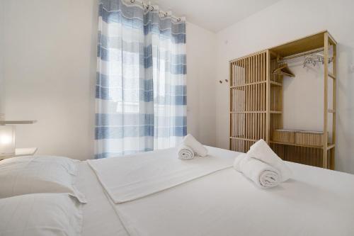 Katil atau katil-katil dalam bilik di Residence Blumar Jesolo Golf Club