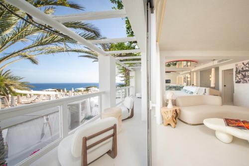 a living room with a view of the ocean at Destino Five Ibiza - 5-Star Grand Luxe Resort in Talamanca