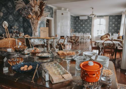 a table with a buffet of food on it at Tammiston Bed&Breakfast in Naantali