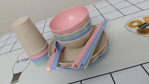 a stack of cups and plates with chopsticks on a table at Heart Bentong Guest House 文冬心宿民宿 Bentong Homestay in Bentong