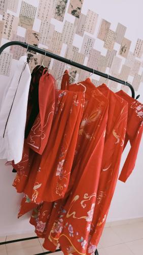 a group of red umbrellas hanging on a rack at Heart Bentong Guest House 文冬心宿民宿 Bentong Homestay in Bentong