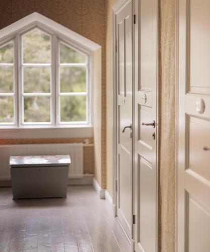 an empty room with a door and a window at Tammiston Bed&Breakfast in Naantali
