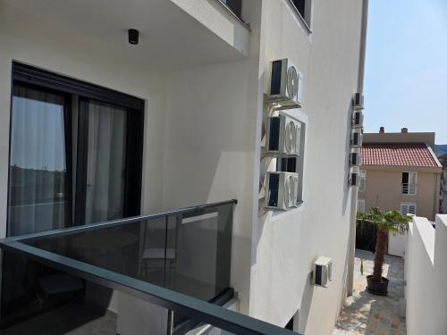 a balcony with a view of a building at Apartments Ivo Herceg Novi in Herceg-Novi
