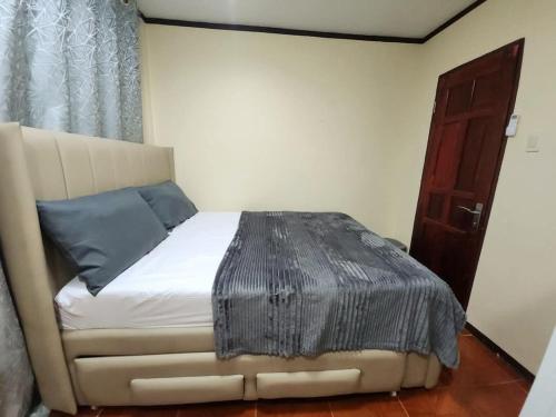 Ένα ή περισσότερα κρεβάτια σε δωμάτιο στο UKG Residence