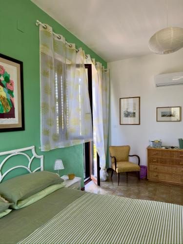 Ένα ή περισσότερα κρεβάτια σε δωμάτιο στο B&B Ondamarina