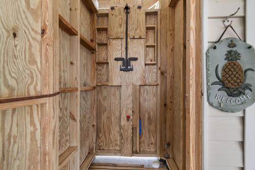 a wood paneled hallway with a sign on the wall at Chipps Ahoy in Oak Island