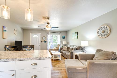 a living room with a couch and a table at Home 7 Mi to Three Sisters and Hunter Springs in Homosassa