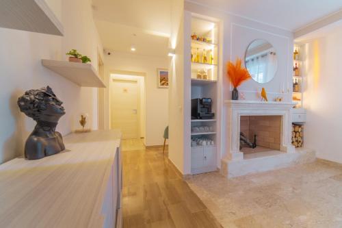 a living room with a fireplace and a mirror at Villa Yucca - B&B and Glamping in Torano Nuovo