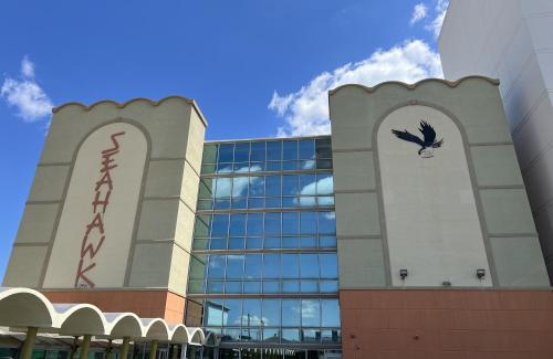 a building with a bird on the side of it at Seahawk Motel in Virginia Beach
