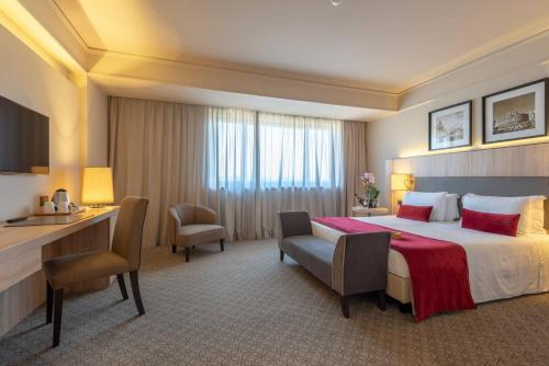 a hotel room with a bed and a desk at A.Roma Lifestyle Hotel in Rome