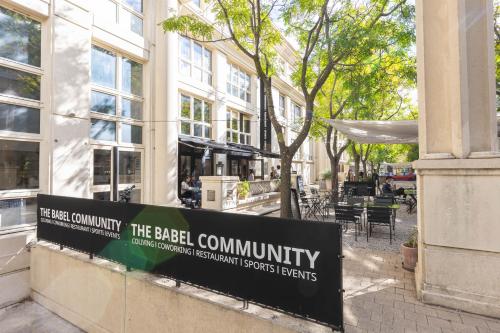 a sign on the side of a building at Babel Community Hôtel - Montpellier centre in Montpellier