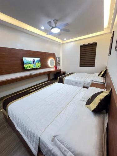Katil atau katil-katil dalam bilik di Lê Tâm E678 Hotel