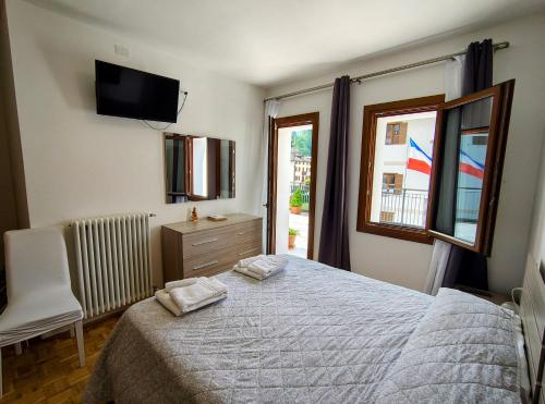 Postel nebo postele na pokoji v ubytování Hotel Da Marco