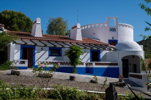 a white and blue house with a red roof at Horta da Moura by WOT Signature in Monsaraz