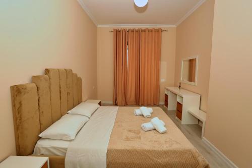 Ένα ή περισσότερα κρεβάτια σε δωμάτιο στο Luxury Apartment Square 21Tirana
