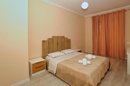 Ένα ή περισσότερα κρεβάτια σε δωμάτιο στο Luxury Apartment Square 21Tirana