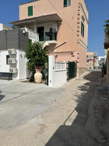 a house with a white door and a porch at Marea in Bari