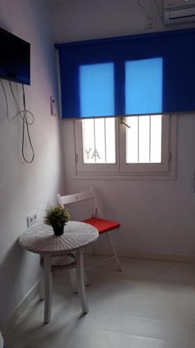 Μια τηλεόραση ή/και κέντρο ψυχαγωγίας στο Habitaciones Taberna de Mauro