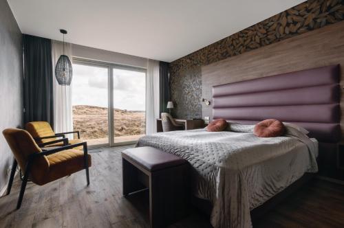 Postel nebo postele na pokoji v ubytování Hotel Kriunes
