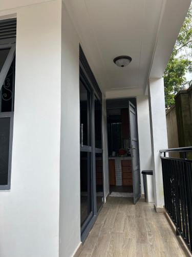 a hallway of a house with glass doors at The Phinez in Seeta