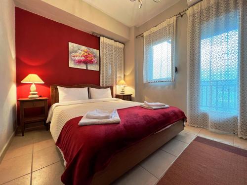 Ένα ή περισσότερα κρεβάτια σε δωμάτιο στο Nea Roda Apartments 2