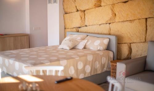 Ένα ή περισσότερα κρεβάτια σε δωμάτιο στο Apartamentos Boutique Murmur