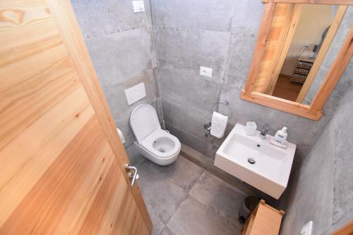 a bathroom with a white toilet and a sink at Suite a 100mt dal Duomo - Living Gallery in Pietrasanta