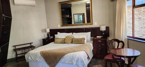 Ένα ή περισσότερα κρεβάτια σε δωμάτιο στο Goodnight Guest Lodge