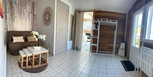 a bathroom with a walk in shower next to a room at La petite saline in Le Croisic