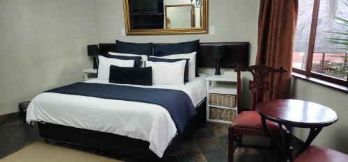 Ένα ή περισσότερα κρεβάτια σε δωμάτιο στο Goodnight Guest Lodge