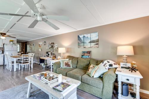 a living room with a couch and a table at Steps to Crystal Lake Spacious Retreat with Views in Barton