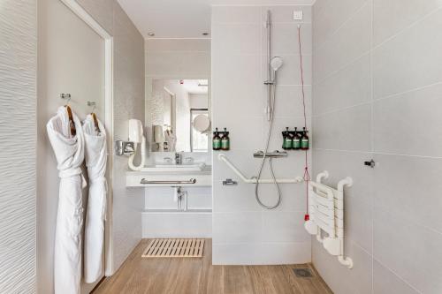 a bathroom with a shower and a sink at Crowne Plaza Lyon - Cité Internationale in Lyon