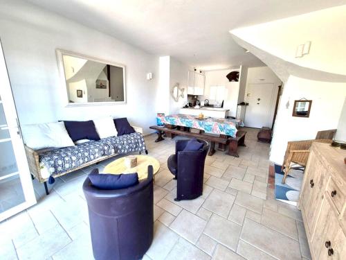a living room with a couch and a table at Fisherman's house in Port Grimaud in Grimaud