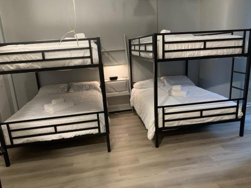 two bunk beds sitting in a room with at South Loop 2 Bedroom Apt in Chicago
