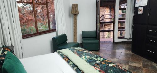Ένα ή περισσότερα κρεβάτια σε δωμάτιο στο Goodnight Guest Lodge