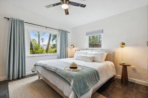 a bedroom with a bed with a hat on it at Steps From The Beach & 3 Miles To Cruise Ports! in Cocoa Beach