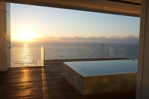a view of the ocean from the balcony of a cruise ship at Prince Palace Hadera Beach Resort in H̱adera