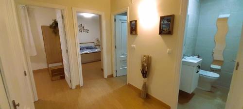 a small bathroom with a sink and a toilet at EnFOZ Playa A Rapadoira in Foz
