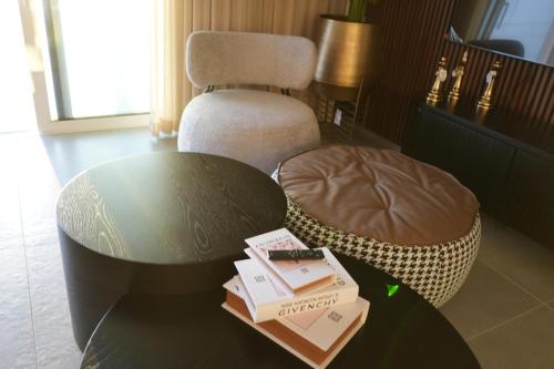 a room with a table and a chair and a table and a table sidx sidx at Prince Palace Hadera Beach Resort in H̱adera