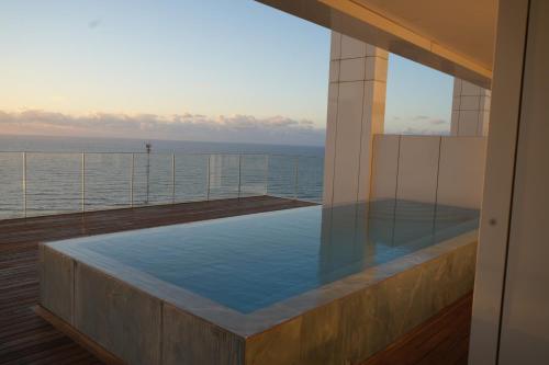 a hot tub on the deck of a cruise ship at Prince Palace Hadera Beach Resort in H̱adera