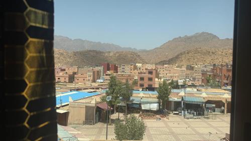 a view of a city with buildings and a pool at Fibule d'or in Tafraoute