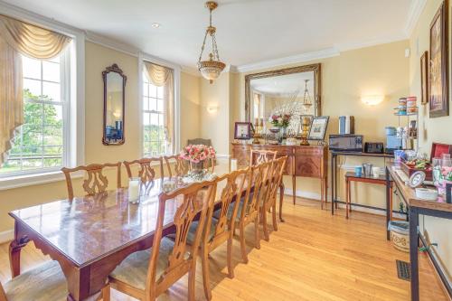 a dining room with a table and chairs and a kitchen at 9-Acre New River Retreat Near Radford University in Fairlawn