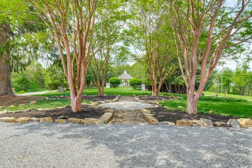 a walkway between two trees in a park at 9-Acre New River Retreat Near Radford University in Fairlawn