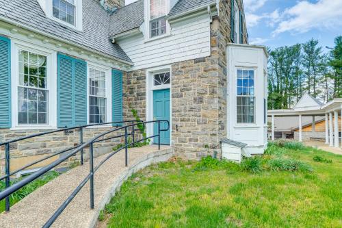 a brick house with a blue door and a yard at 9-Acre New River Retreat Near Radford University in Fairlawn