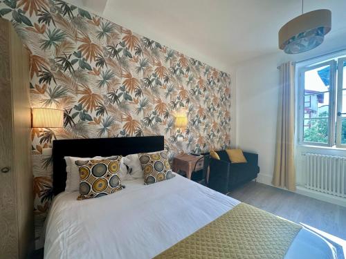 Hôtel Parc Mazon-Biarritzにあるベッド