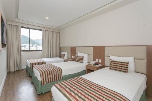 Кровать или кровати в номере Mirador Rio Copacabana Hotel