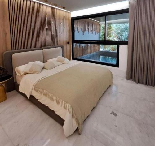 Voodi või voodid majutusasutuse Villa Luxueuse avec Vue Panoramique toas