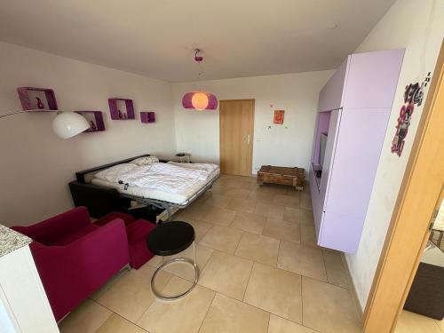a small room with a bed and a couch at Penthouse at Cologne Cathedral in Cologne