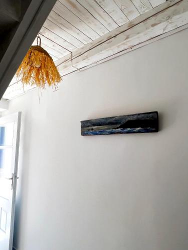 a painting on a wall next to a ceiling at August Elafonisos in Elafonisos