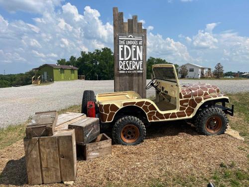 a jeep parked in front of a sign at The Lodges at Eden Reserve - Back Cabins - Near Ark in Williamstown